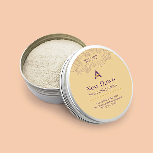 New Dawn face mask powder with kaolin, yellow clay, pumice and grapefruit to revive dull skin. Packaged in an eco-friendly aluminium tin.