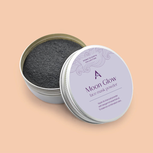 Moonglow charcoal and bergamot face mask powder for combination skin packaged in eco-friendly aluminium tin.