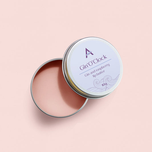 Gin O'Clock pink vegan lip balm with gin and raspberry flavour in a 10g aluminium tin.