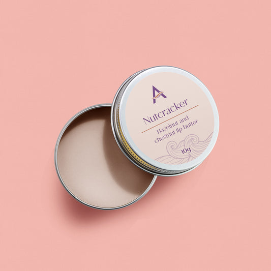 Nutcracker Lip Balm tin with vegan hazelnut lip care formula
