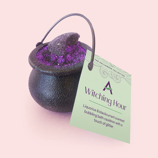 A purple and black Witching Hour bubbling bath cauldron with liquorice and blackcurrant fragrance.