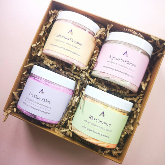 Gift box with four full sized body scrubs and bamboo spoon