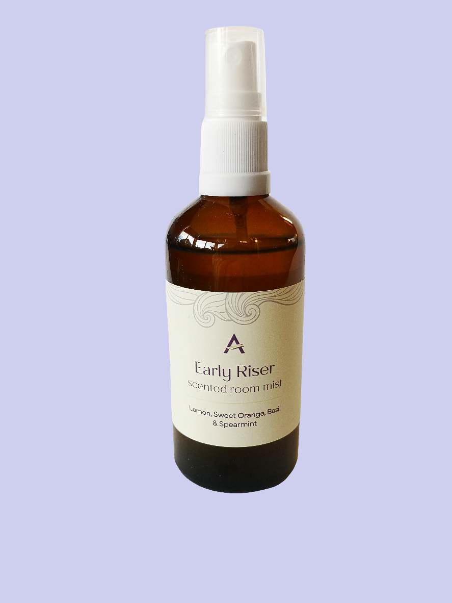 amber glass bottle with spray attachment and label