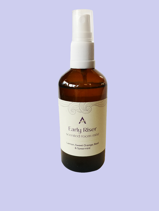 amber glass bottle with spray attachment and label