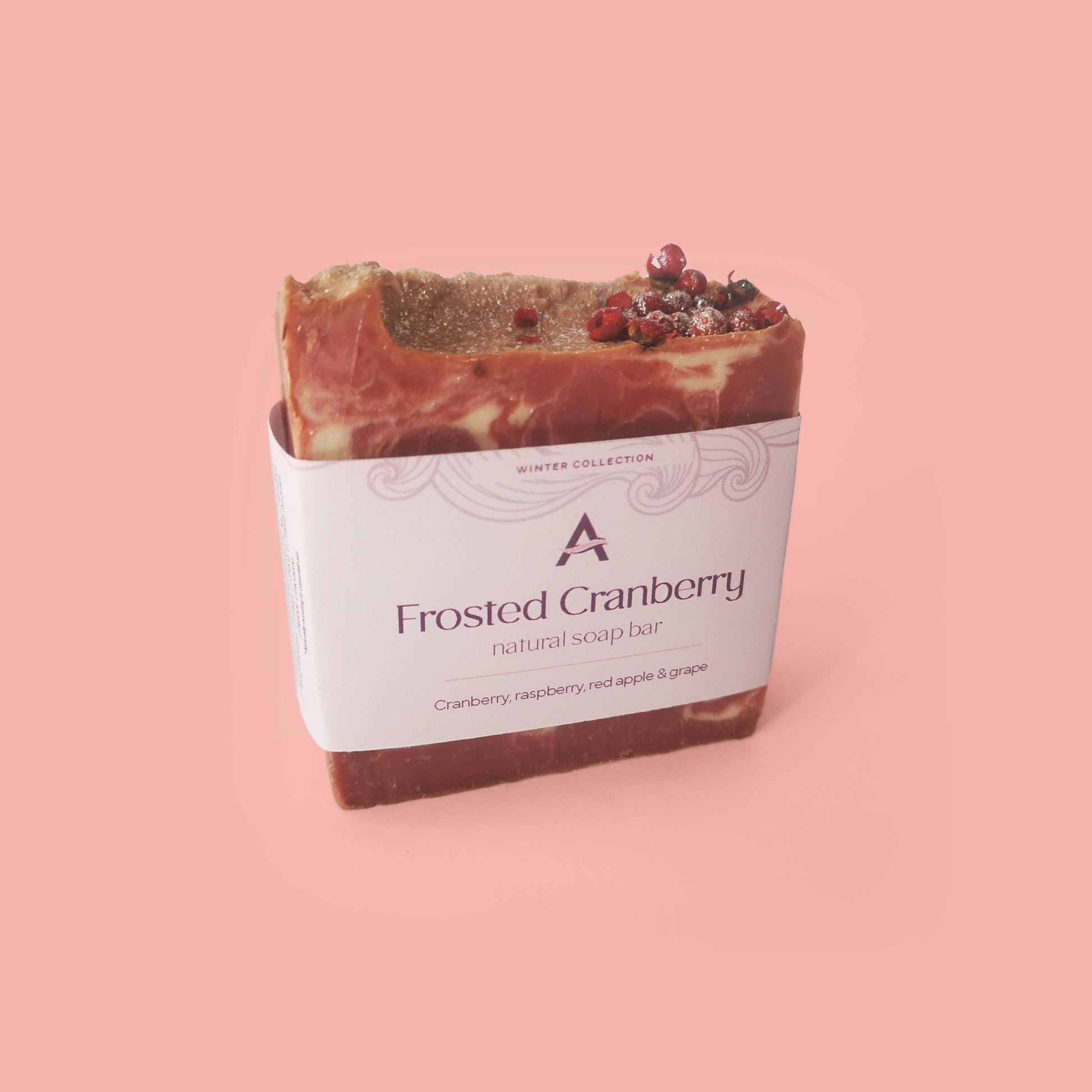 pink and white soap bar with pink peppercorns and label