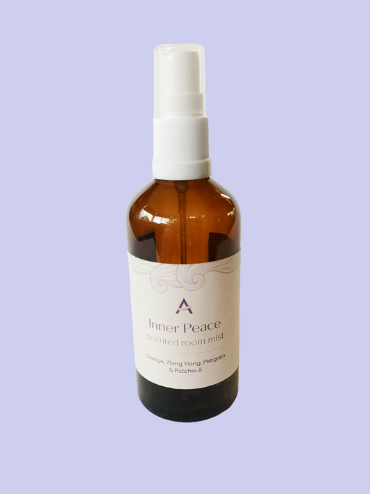 amber glass bottle with spray attachment and label