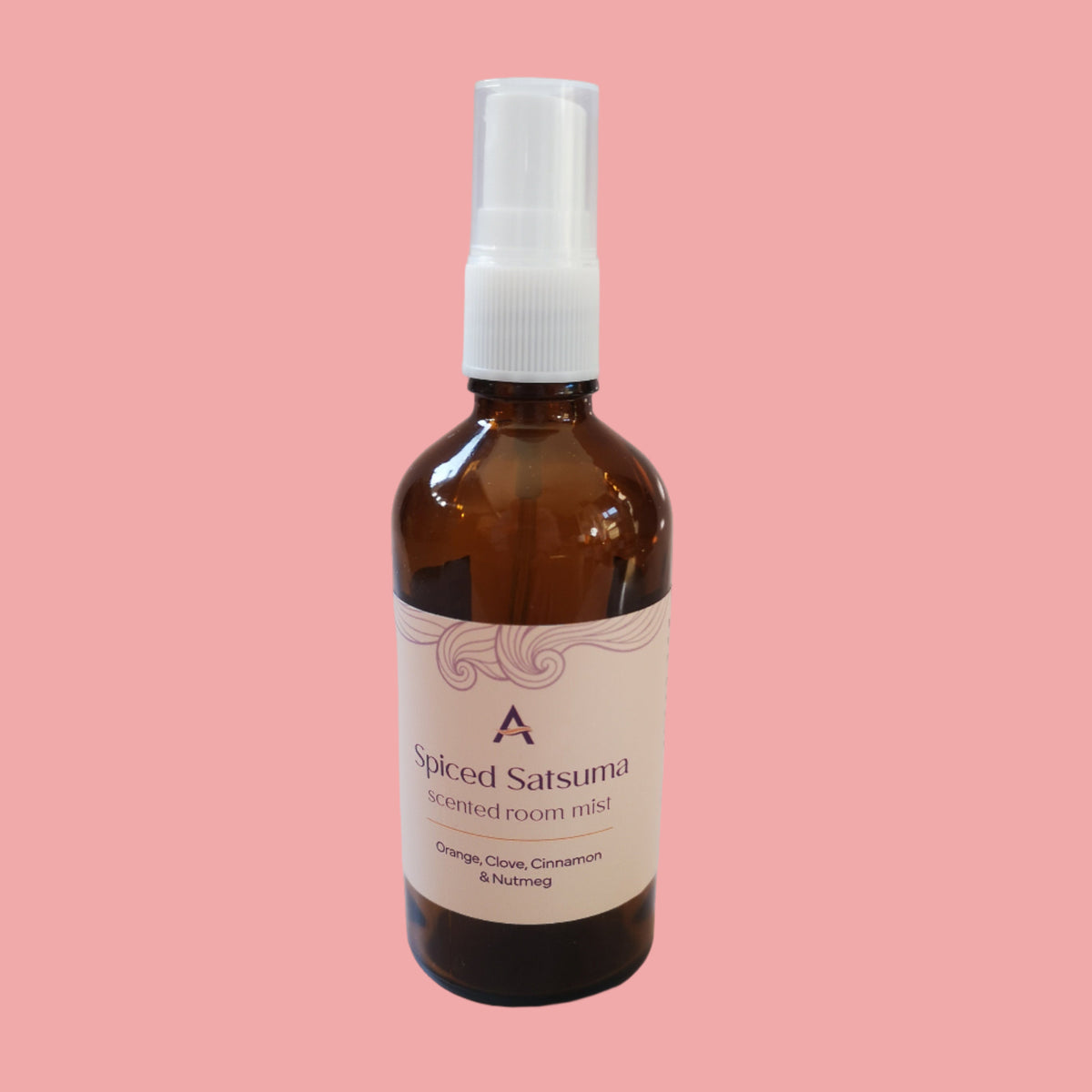 Orange, clove, cinnamon & nutmeg room mist in amber glass bottle.