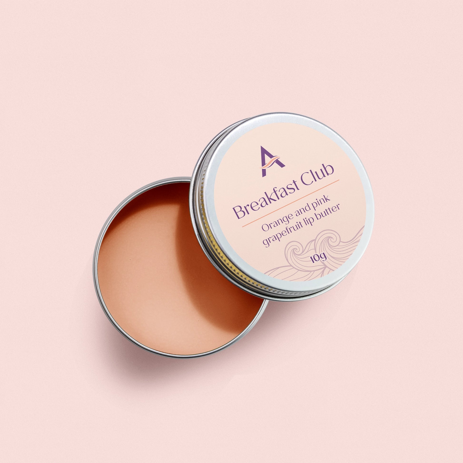 Breakfast Club orange and grapefruit lip balm tin
