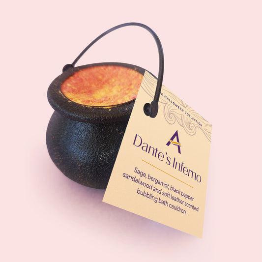 black cauldron with red yellow and orange bath bomb mix inside 