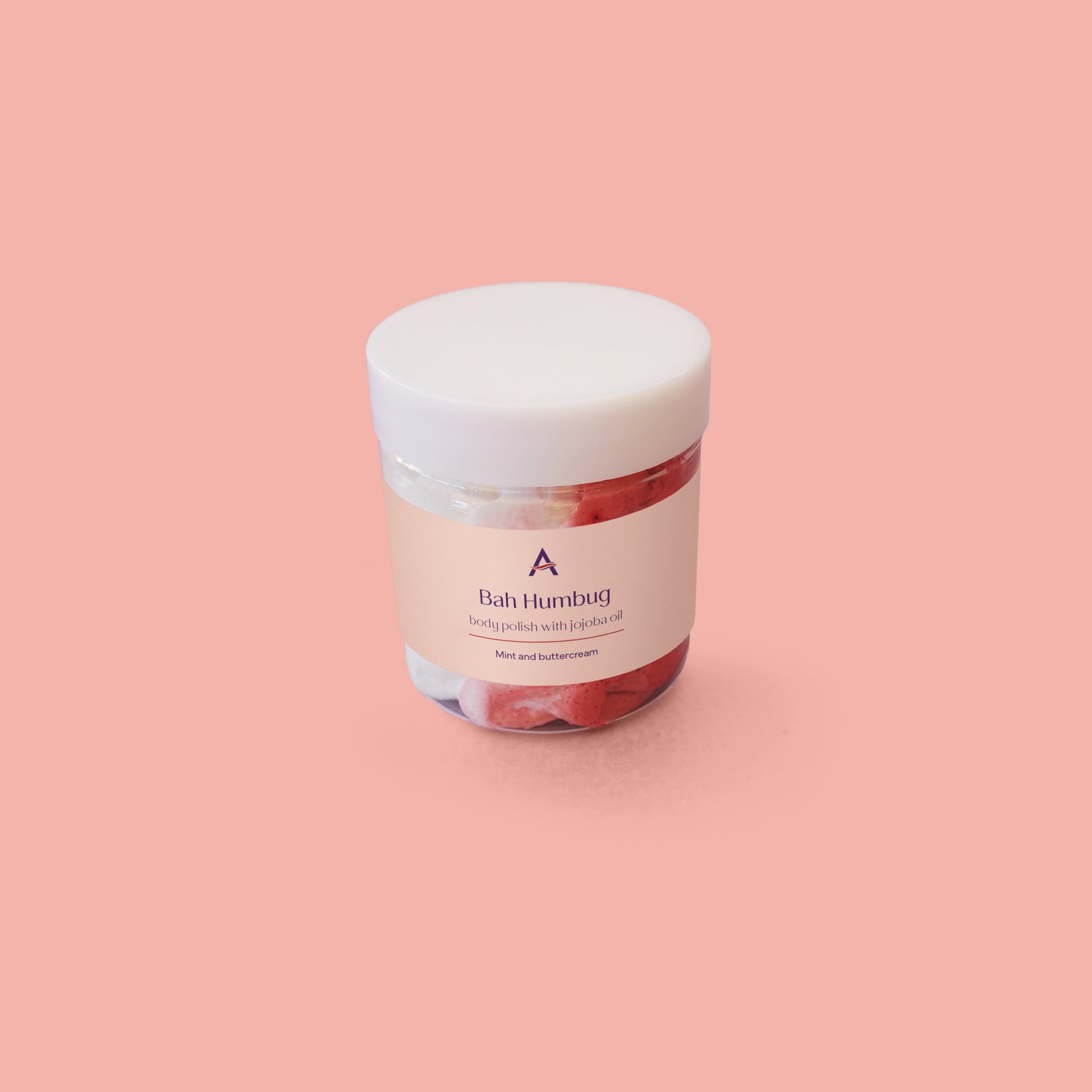 small red and white body scrub in pot