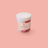 small red and white body scrub in pot