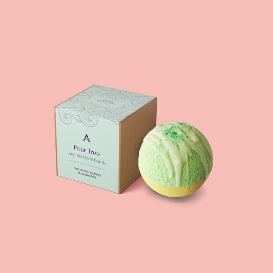 Handmade pear bath bomb with vanilla and raspberry fragrance and cocoa butter drizzle
