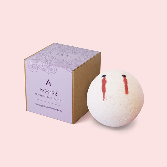 white bath bomb with vampire bite detail and presentation box